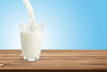 Pouring water into glass on wooden table, blue white background