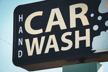 Old worn hand car wash sign