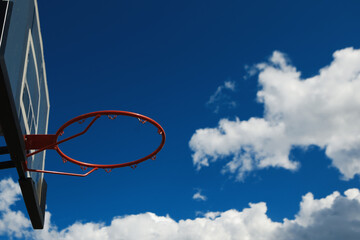 red basketball hoop on the sky background