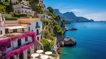 Luxurious villa nestled along the breathtaking Amalfi Coast of Italy, with panoramic views of the sparkling Mediterranean Sea and cliffside terraces