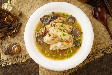 Special Chinese food stewed chicken with mushrooms on retro dark background