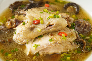 Special Chinese food stewed chicken with mushrooms on retro dark background
