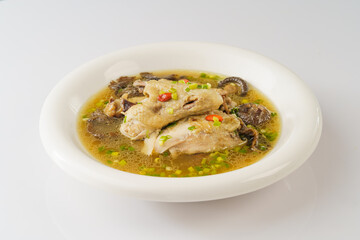 Special Chinese food stewed chicken with mushrooms on retro dark background