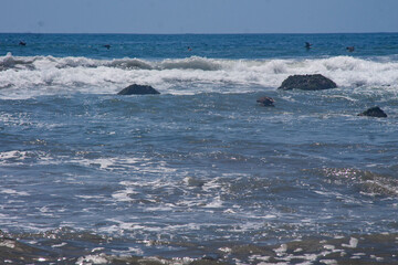 Waves crashing on the rocks at the seashore