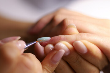 Obraz na płótnie Canvas The process of nail polish coating