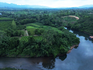 Fototapeta na wymiar Top view from a drone on river Kwai in the province Kanchanaburi of Thailand. Beautiful landscapes of Thailand