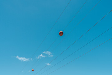 Balls Hang on Power Lines， visibility markers on power lines to help protect aircraft and equipment. Diamond Head Crater, Honolulu, Oahu, Hawaii
