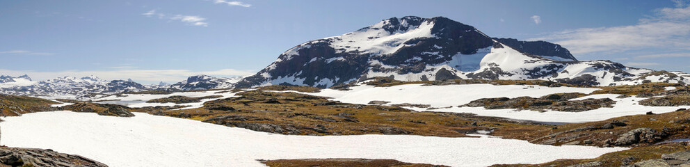 Fototapeta na wymiar Panorama. Mountains along the Sognefjellet mountain road in Norway. Sognefjellsvegen - The National Tourist Route. RV 55