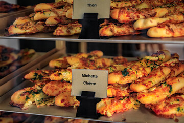 Open faced michette flatbread sandwiches with goat cheese and thuna at a bakery in the medieval Saint Paul de Vence, French Riviera, South of France