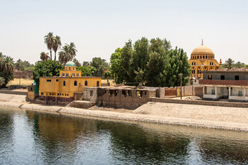 Panoramic view of fertile banks of Nile and everyday life during river cruise River near Luxor...