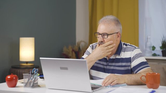 Home office worker old man thinking depressed and feeling unhappy.