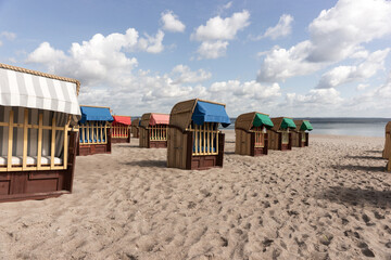 Beach chairs on Timmendorfer Strand on the Baltic sea with blue sky. Germany