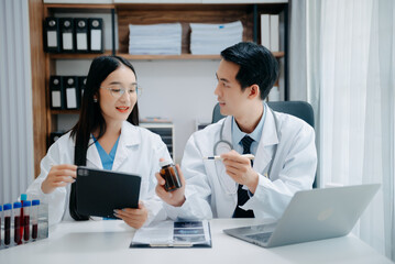 Fototapeta premium Portrait of Asian doctor speaking to colleagues during medical meeting in conference room or Medical Laboratory