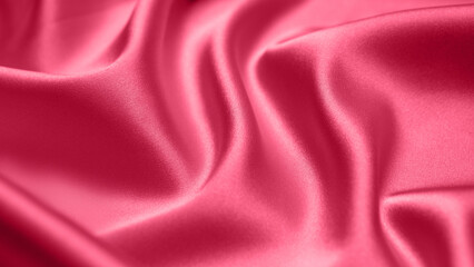 Viva Magenta toned red magenta fabric atlas. Close up pink silk satin texture for sewing. Abstract background wallpaper. Twisted folds cloth. Trendy color of the year 2023. Fashion color pattern

