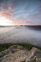 Mystical Sunrise at Wachtfelsen, Palatinate Forest. Captivating landscape shot amidst fog and clouds near Wernersberg, Germany