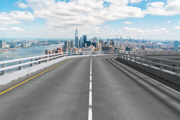 Obraz premium Empty urban asphalt road exterior with city buildings background. New modern highway concrete construction. Concept of way to success. Transportation logistic industry fast delivery. New York. USA.