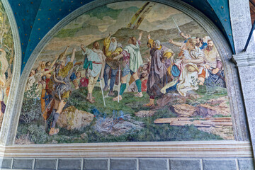 Famous Tell's Chapel at lakeshore of Lake Uri with colorful paintings of Wilhelm Tell saga on a...