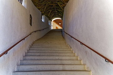 Stairway at cloister of the old town of Swiss City of Zug on a sunny spring day. Photo taken May...