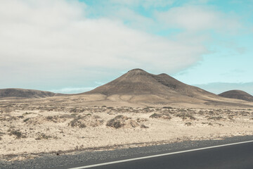 View of the strange, unfriendly but fascinating deserted landscape of the island volcanoes of the center of Fuerteventura. North part of the island.