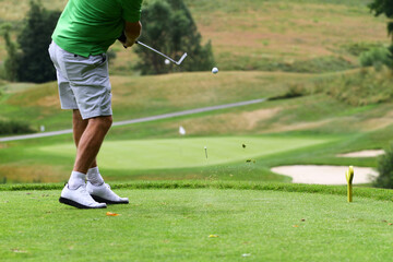 Golf swing with ball to golf green with flag