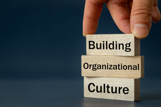 A Wooden Block With The Words Building, Organizational, Culture, Modern Approach To Working With People In A Team, Creative Concept, Copy Space