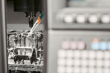 Metalworking CNC milling machine. Metal cutting, modern technology.