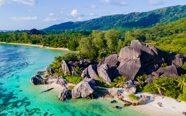 Anse Source d'Argent, La Digue Seychelles, a young couple of men and women on a tropical beach...