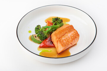 Grilled salmon fillet with vegetables.Healthy food. Healthy breakfast. Grilled vegetables with fish. Isolated object.Copy space.