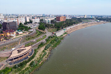 Fototapeta premium new embankment on the bank of the Irtysh river in city of Pavlodar, Kazakhstan. top view from the drone from above