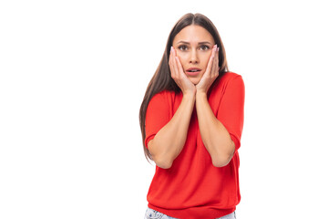 young excited brunette lady dressed in a red t-shirt on a white background