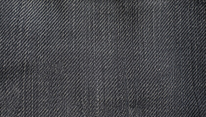 Fototapeta na wymiar Dark gray denim background. The texture of black fluted denim. Background of black jeans.