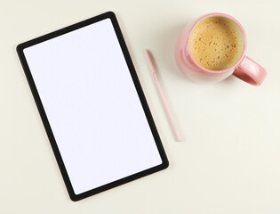 Fototapeta na wymiar flat lay of digital tablet with blank white screen, pink stylus pen and pink cup of coffee isolated on white background.