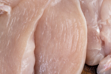 fresh and raw chicken meat during cooking