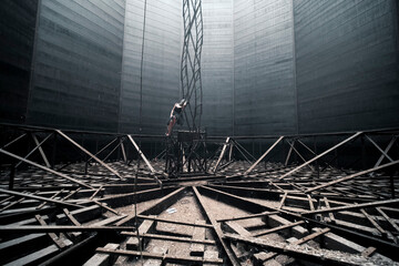 girl with gas mask in abandoned gasometer