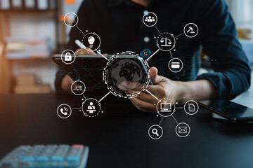 Copyright or patent concept, Person hand using laptop computer, tablet and smartphone with virtual screen copyright icon trademark, Creation ownership against piracy at office.