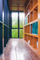 Bookshelf with steel and glass wall inside of vintage library room in perspective view and vertical frame