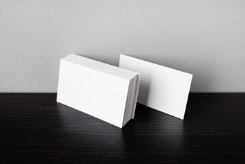 Photo of blank white business cards. Mock-up for branding identity. Blank template for design presentations and portfolios.