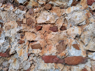 plastered and old orange brick wall