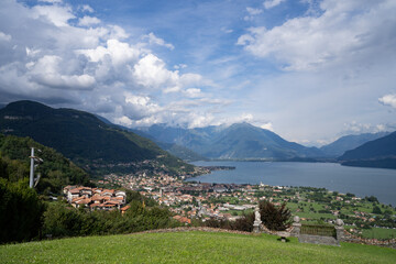 Fototapeta na wymiar North Como Lake day view in Lombardy with houses and water 