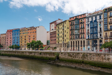 Bilbao, SPAIN - July 19 2022: City center of Bilbao. Beautiful building architecture. View of River Nervion and his promenade area. Travel destination in North of Spain. Largest city in Basque Country