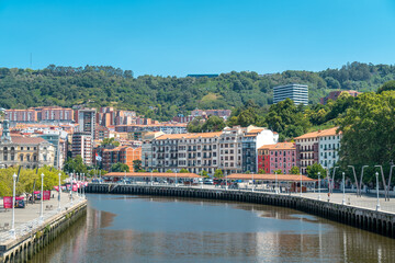 Promenade area of the River Nervion. In background the old city of Bilbao in front plane the river Nervion. Travel destination in North of Spain, Basque Country