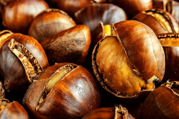 Close-up of roasted chestnuts. Healthy eating. Street food concept. Selective focus, blurred background.