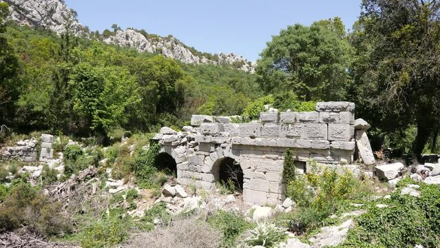 Heritage ruins sarnic in ancient city of Termessos in Taurus Mountains, region of ancient Pisidia. Archaeological sites of Turkey