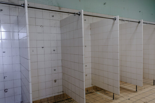 Showers in the sports department of an abandoned school