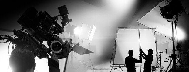 Silhouette of video production behind the scenes or B roll or making of TV commercial movie that...
