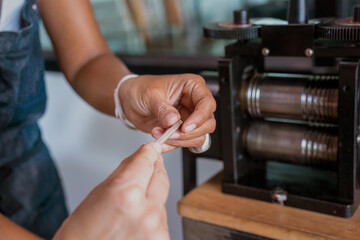 Teacher jeweler and student make jewelry in workshop