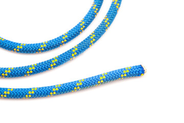 durable colored rope for climbing equipment on a white background. knot of braided cable. item for...