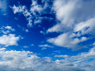 Naklejka na ściany i meble Blue sky and beautiful soft white clouds good weather for background