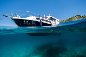 Fototapeta na wymiar Yacht floating in blue sea