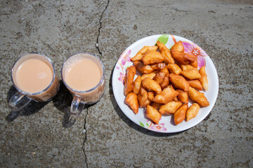 Tibetan Salt Ghee Tea and Khapse Deep Fried Doughnut Snack, a Himalayan Food in Nepal
